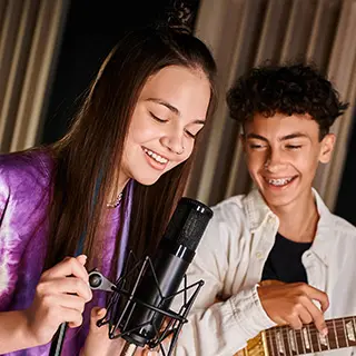 image of two students singing