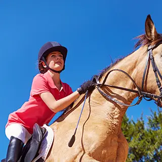 image of a student riding a horse